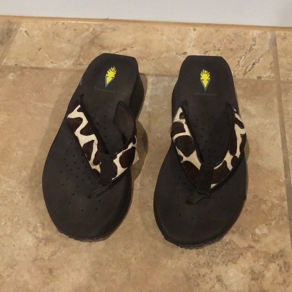 Volatile brown cheetah flip flops